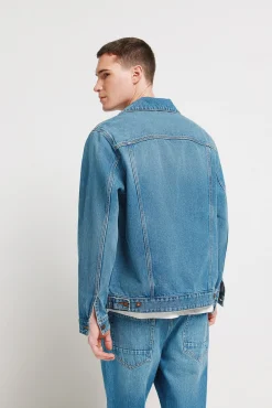 Blouson en denim d&eacute;lav&eacute; moyen fonc&eacute;