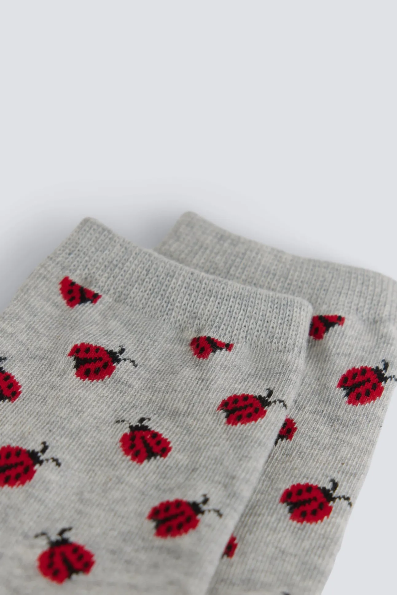 Chaussette longue à coccinelles