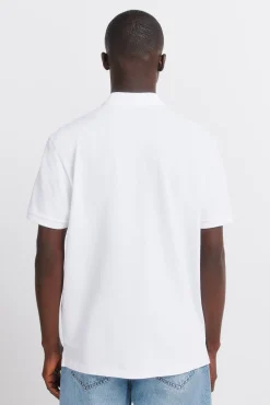 Polo en piqu&eacute; &agrave; rayures imprim&eacute;es regular fit