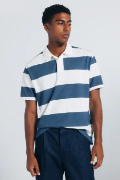 Polo piqu&eacute; coupe classique &agrave; larges rayures